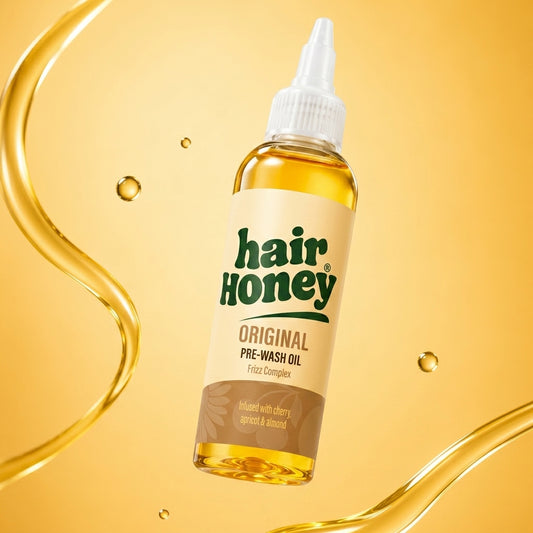 Smoothing Oil for Knotty, Tangled Hair - Pre-Wash Syrup in a bottle with a background of smooth hair.