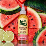Hair Syrup Watermelon Oil - Pre-Wash Treatment for Dry Hair in use, applied to dry hair with a brush.