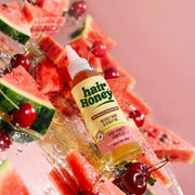 Hair Syrup Watermelon Oil - Pre-Wash Treatment for Dry Hair displayed with fresh watermelon slices and a towel.