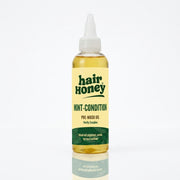 Mint Condition Scalp Oil for Flaky, Itchy Scalp Relief in a glass bottle on a wooden surface.