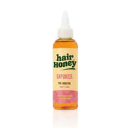 Rapunzel Pre-Wash Hair Oil for Growth Boost displayed with lush green background and hair strands.