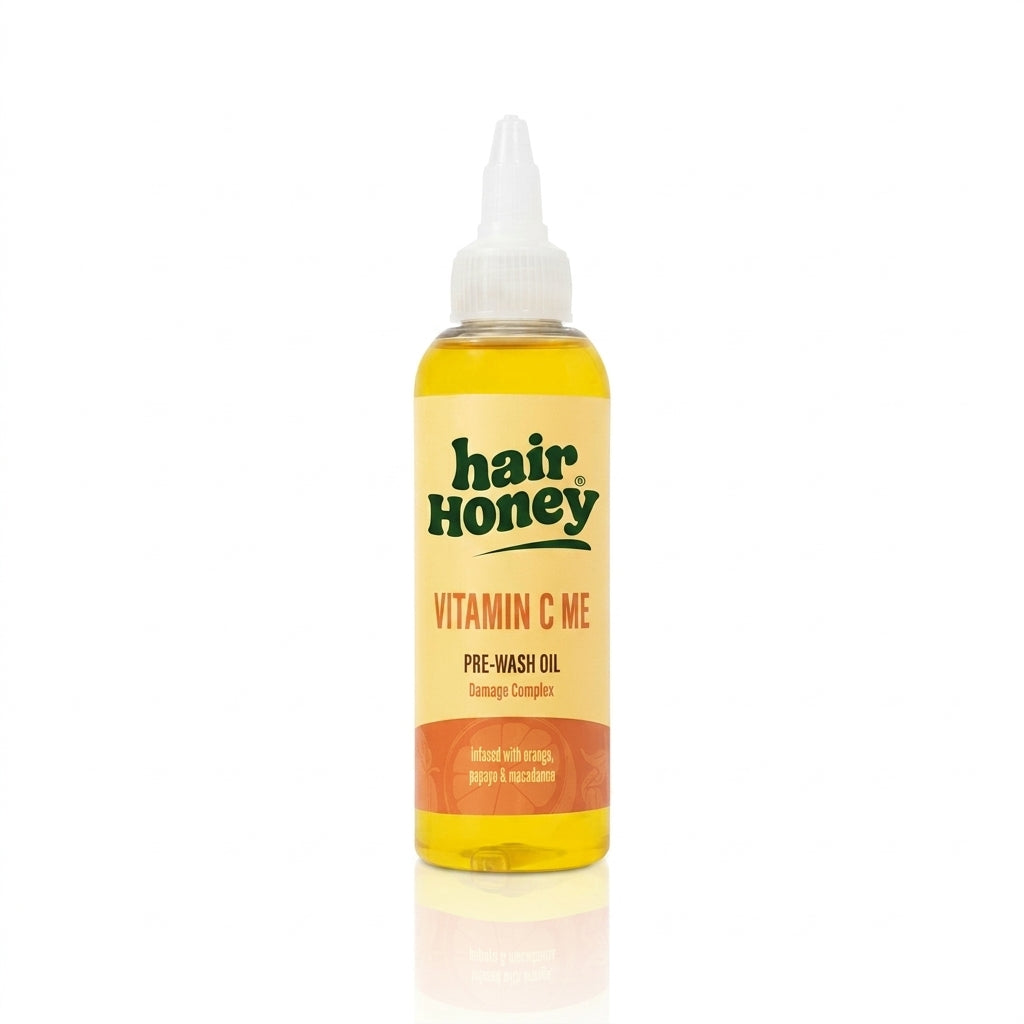 Vitamin C Pre-Wash Treatment for Damaged, Brittle Hair in a stylish bottle on a wooden surface.