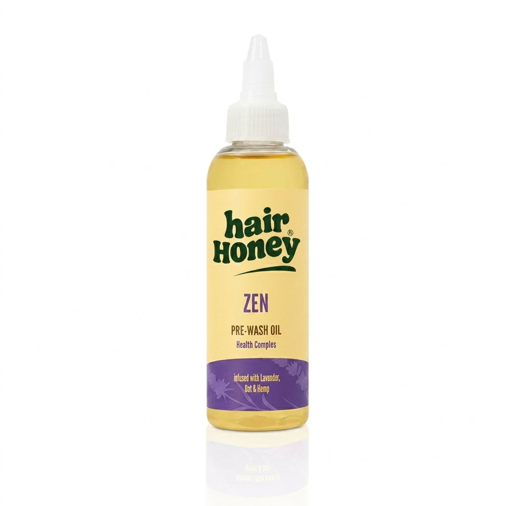 Zen Pre-Wash Oil for Dull, Frizzy Hair Treatment in a glass bottle with a dropper on a wooden surface.