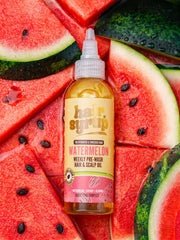 Watermelon Oil Hair Syrup - Rosemary & Thyme Infused being applied to hair for nourishment.