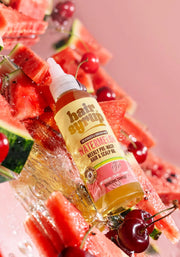 Flat lay of Watermelon Oil Hair Syrup - Rosemary & Thyme Infused with watermelon slices and herbs.